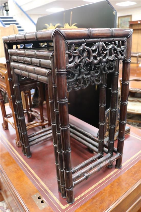 A nest of three Chinese hardwood tea tables W.48cm